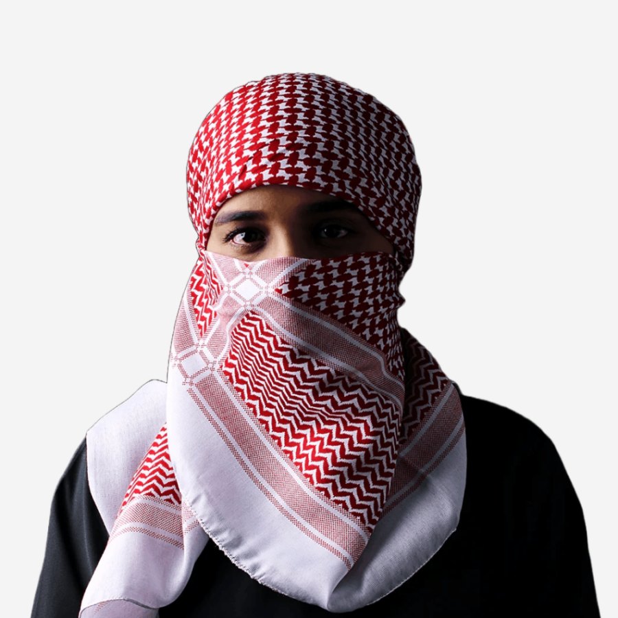 Red and white keffiyeh worn as a ghutrah